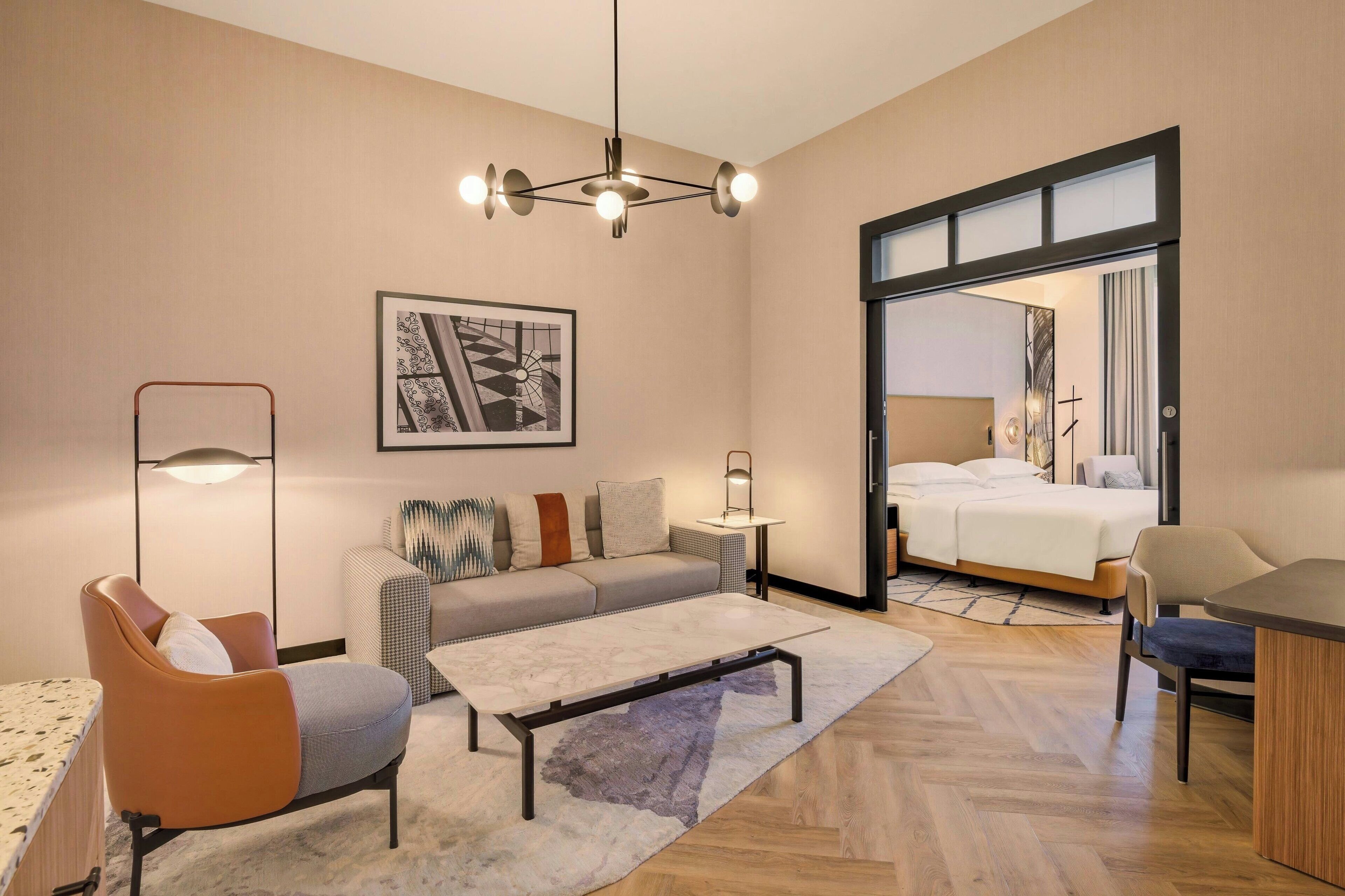 Grand Suite, 1 Bedroom | Living room | 49-inch TV with satellite channels