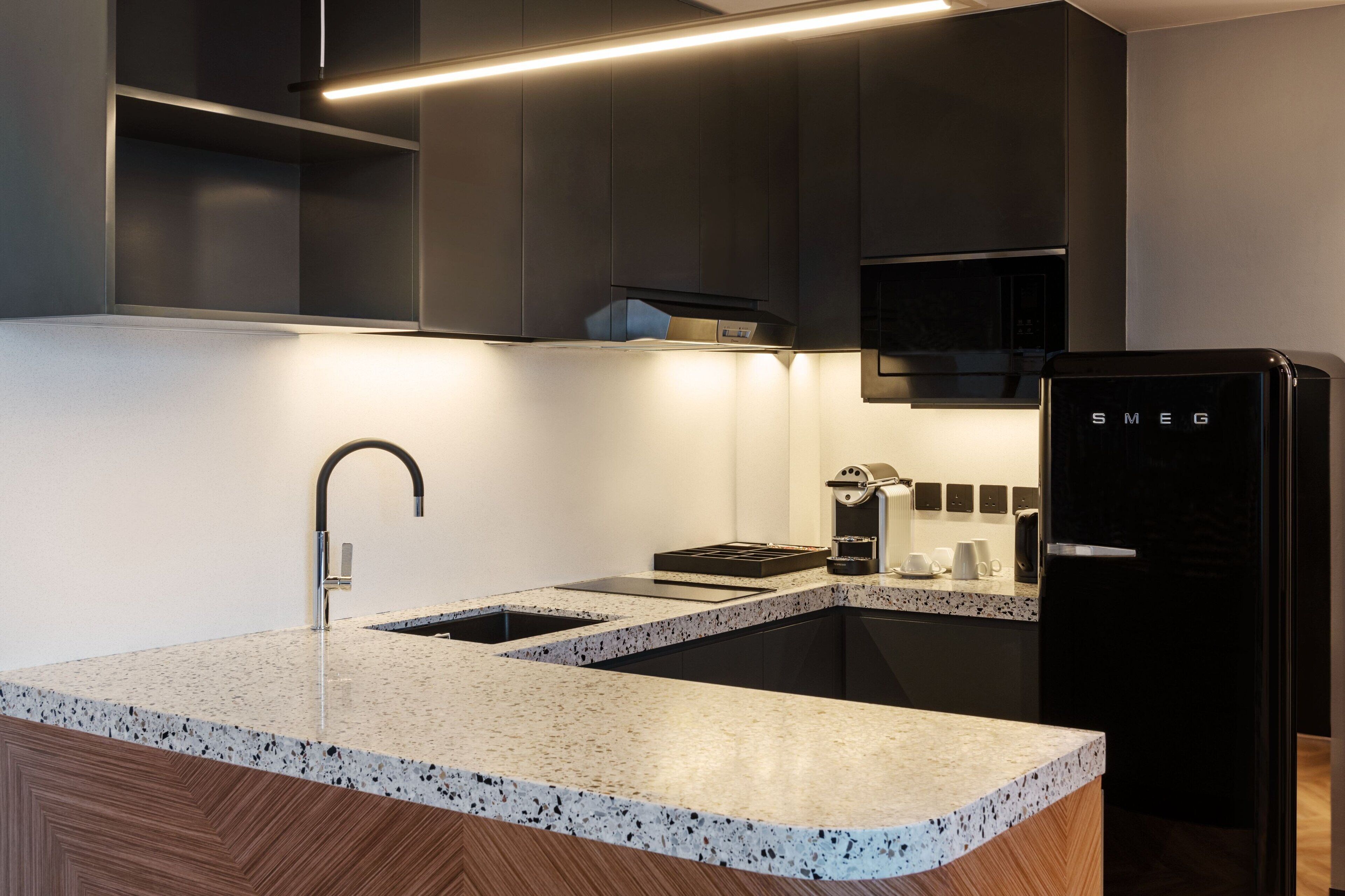 mini-fridge, coffee/tea maker, high chair, dining tables