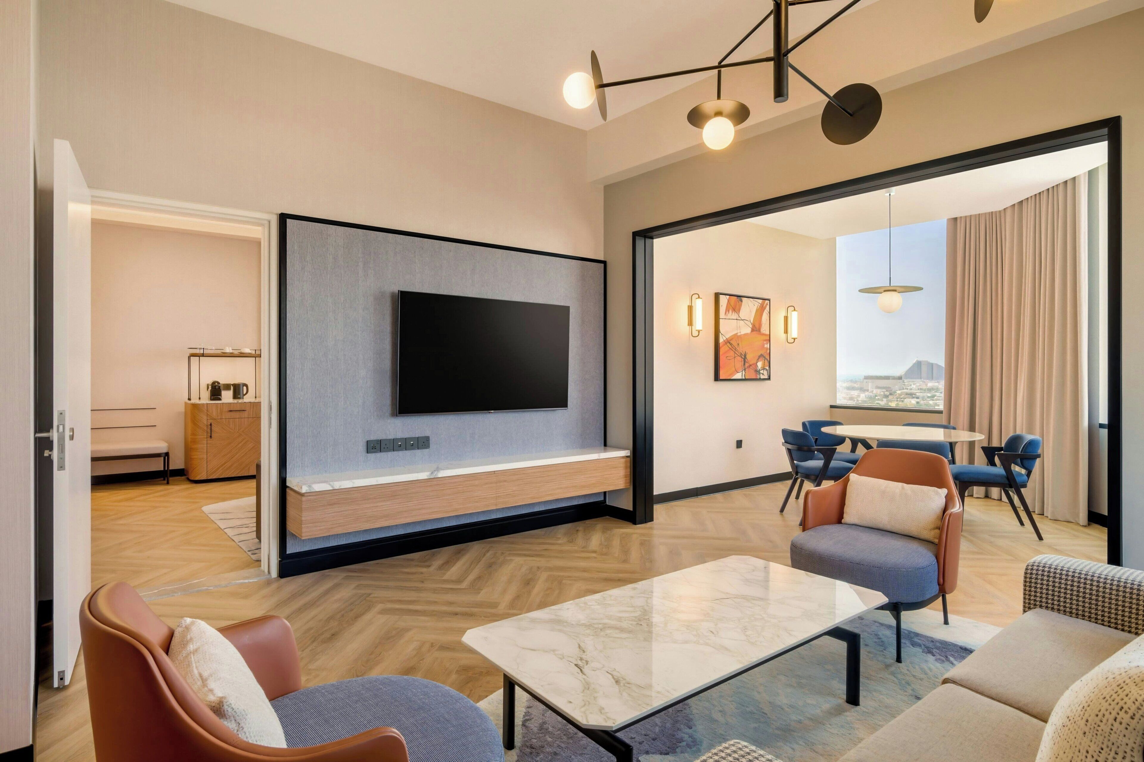 Amiri Family Suite Club lounge Access including Breakfast, Evening Cocktail hours & Soft Refreshment | Living area | 49-inch TV with satellite channels