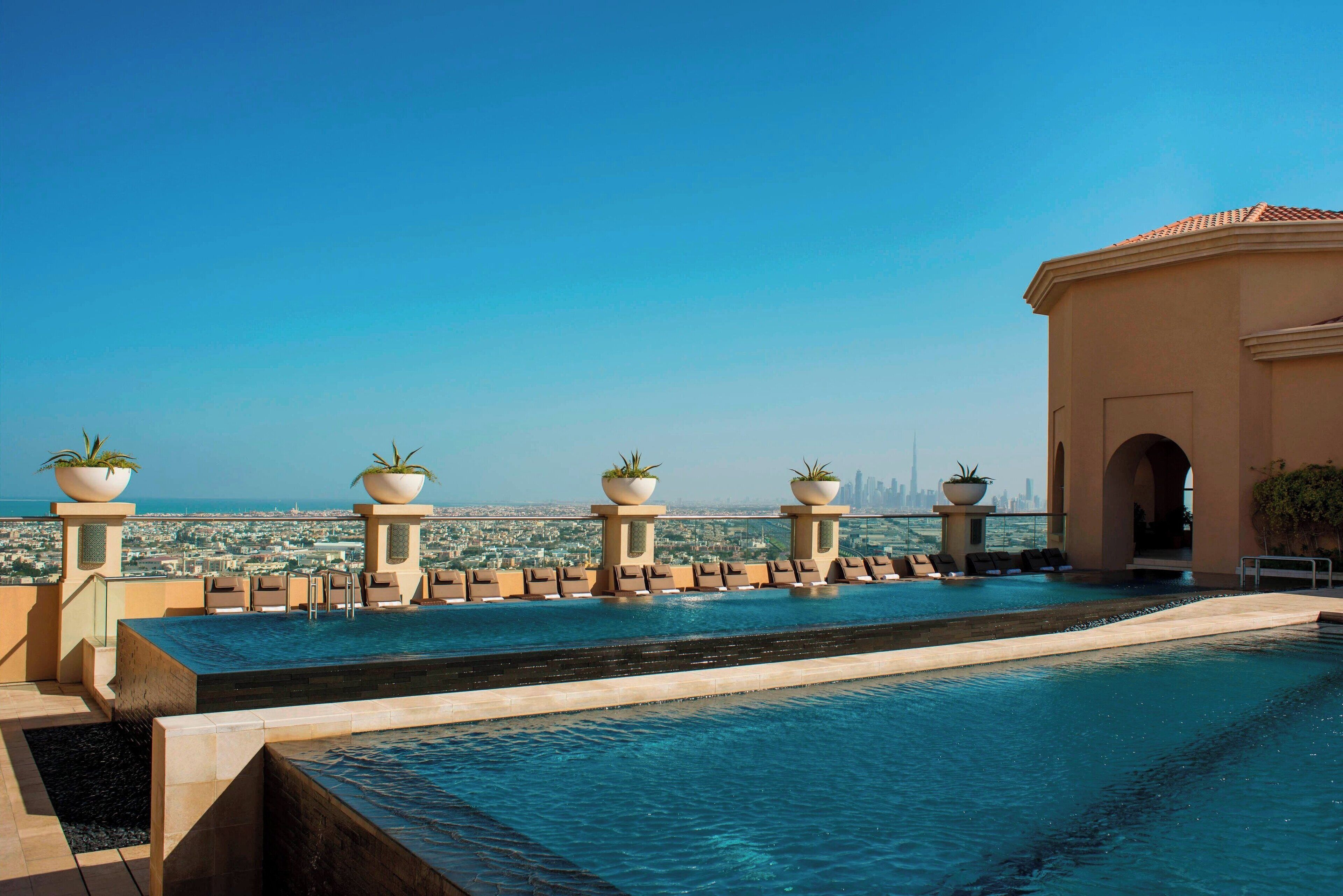 2 outdoor pools, open 7:00 AM to 7:00 PM, pool umbrellas, sun loungers