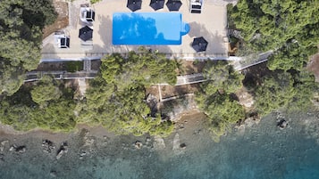 Seasonal outdoor pool, pool umbrellas, pool loungers