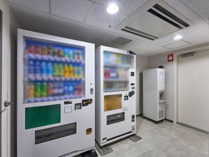 Vending machines with a selection of beverages and a refrigerator in a hallway. - Daiwa Roynet Hotel Oita (Oita)