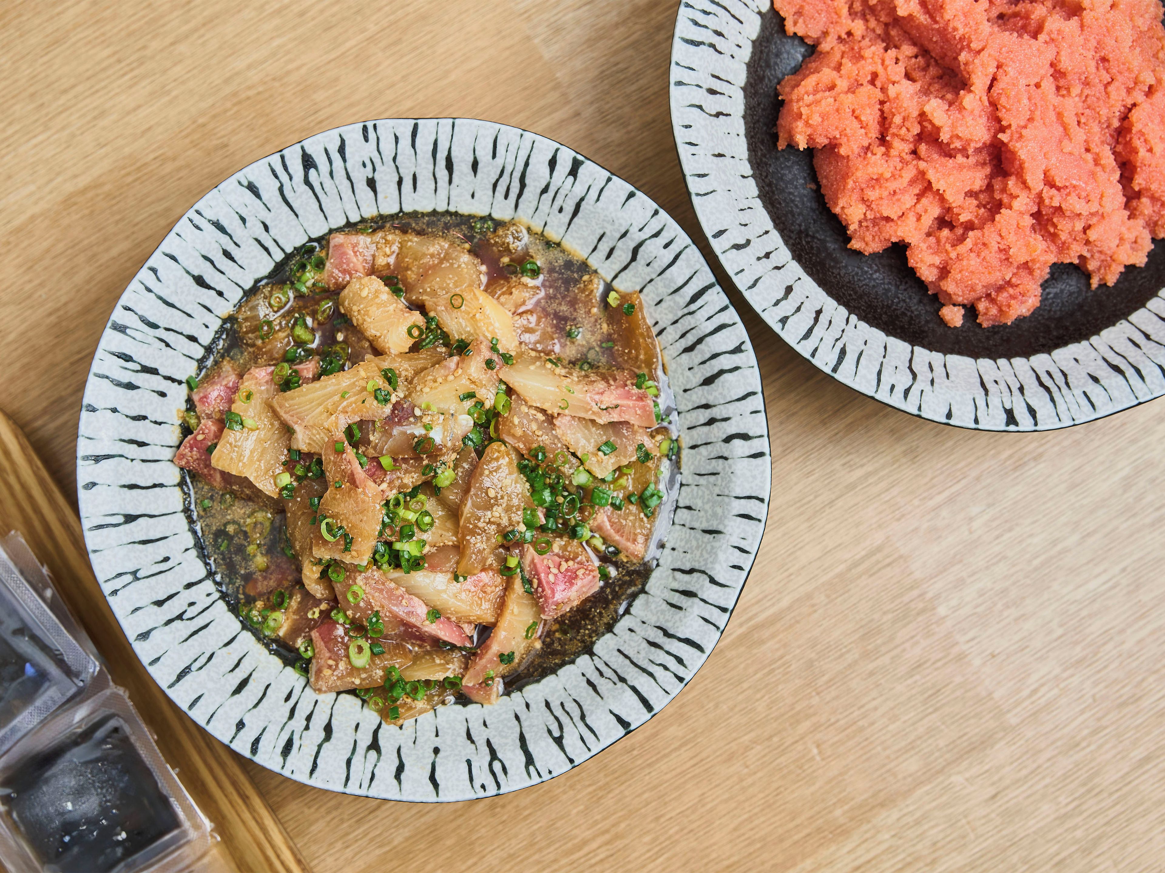 A plate of food with various ingredients and garnishes.