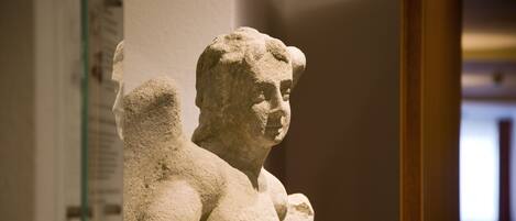 A stone sculpture in a museum setting.
