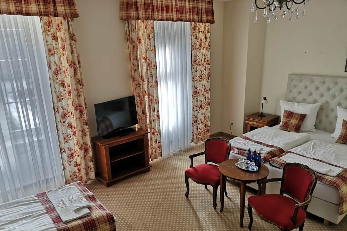 Standard Triple Room | In-room safe, individually decorated, desk, iron/ironing board