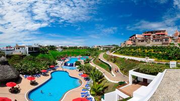 5 outdoor pools, open 8:00 AM to 6:00 PM, pool umbrellas, sun loungers