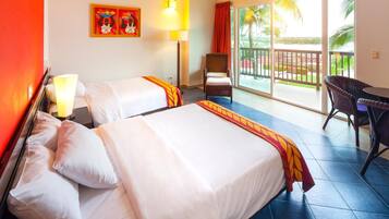 A hotel room with two beds, a chair, a table, a balcony with a view, and a painting on the wall.