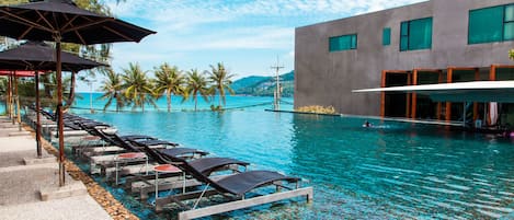 Outdoor pool, open 10 AM to 7 PM, pool umbrellas, sun loungers