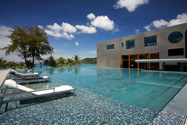 Outdoor pool, open 10 AM to 7 PM, pool umbrellas, pool loungers