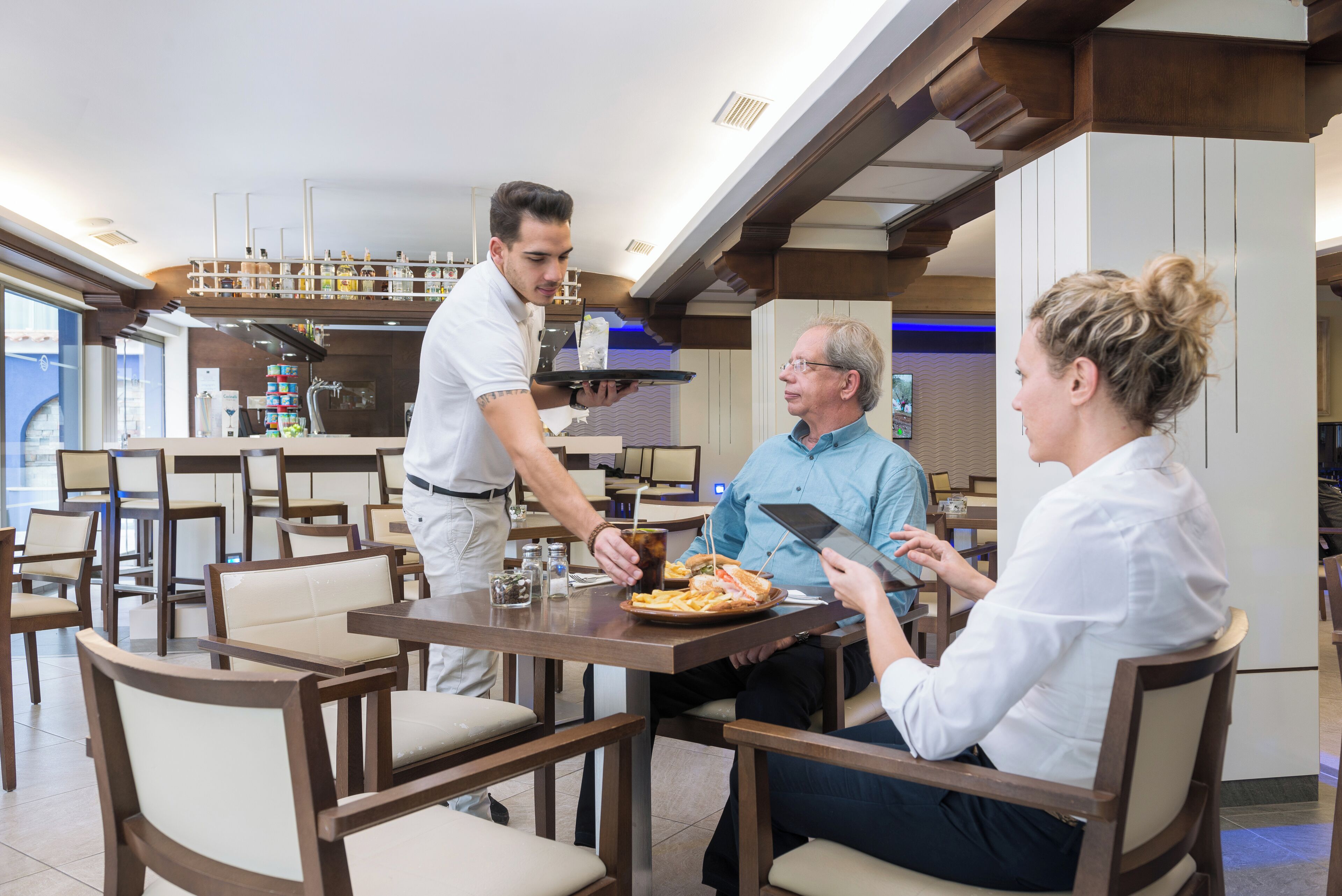 A restaurant with wooden furniture and a modern interior.