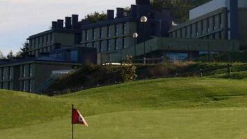 Enjoy a round of golf at this scenic course, surrounded by lush greenery and a modern clubhouse.