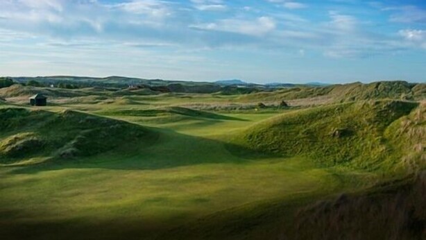 A golf course with rolling green hills and a clear sky. - Flynns of Termonfeckin (Termonfeckin)