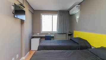 Premium Duplo Solteiro | 1 bedroom, pillow-top beds, individually furnished, laptop workspace