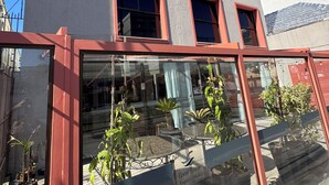 The exterior of Coral Tower Express Hotel with a clear blue sky. - Coral Express (Porto Alegre)