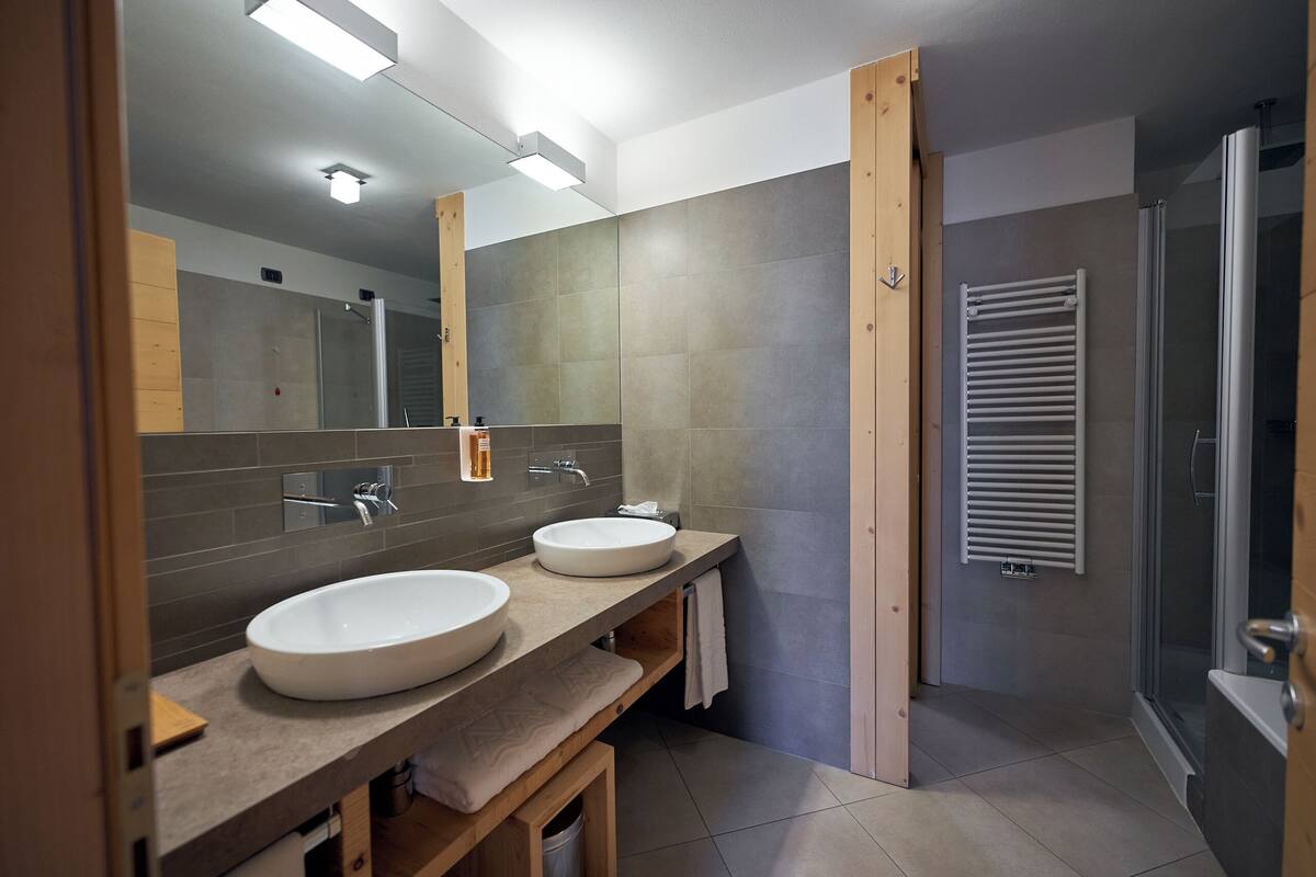 family suite | bathroom | separate bathtub and shower, jetted bath, rainfall showerhead
