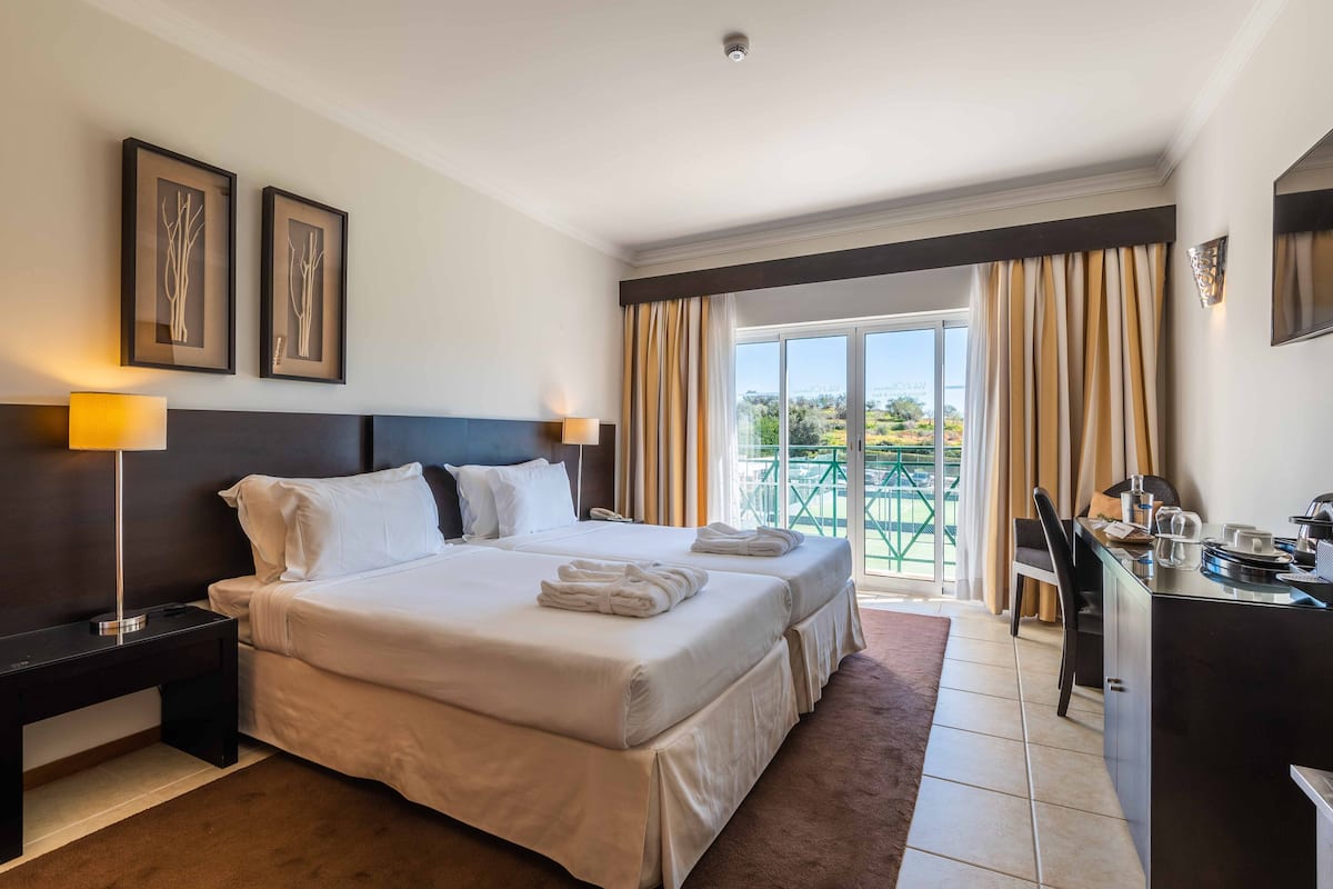 Standard Double or Twin Room, Garden View | 1 bedroom, in-room safe, desk, blackout curtains