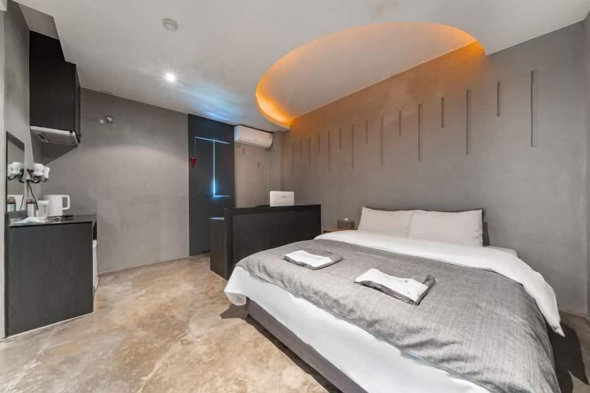 Premium bedding, down comforters, pillowtop beds, free minibar
