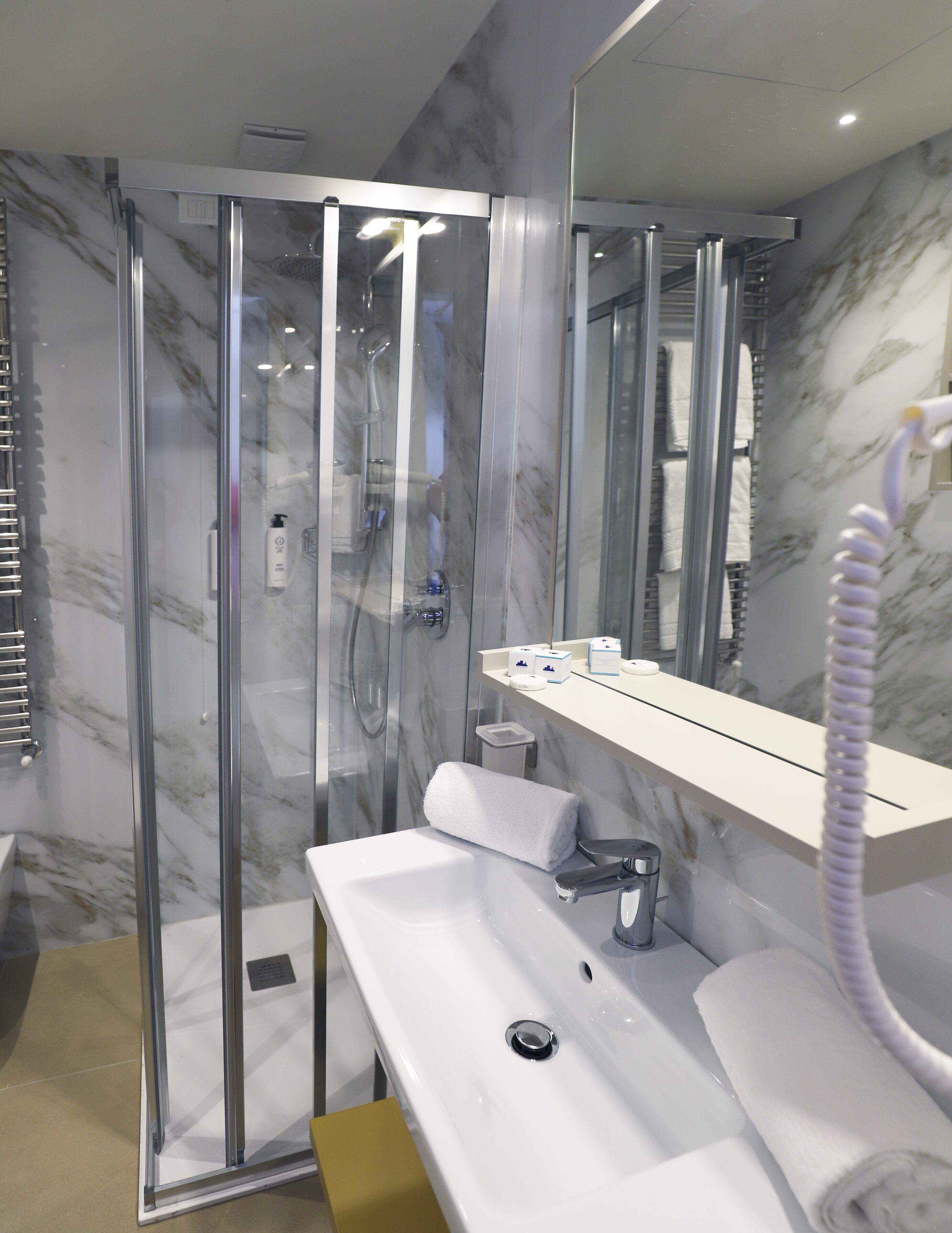 free toiletries, hair dryer, bidet, towels