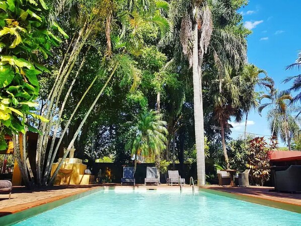 Outdoor pool, open 9 AM to 7 PM, pool loungers