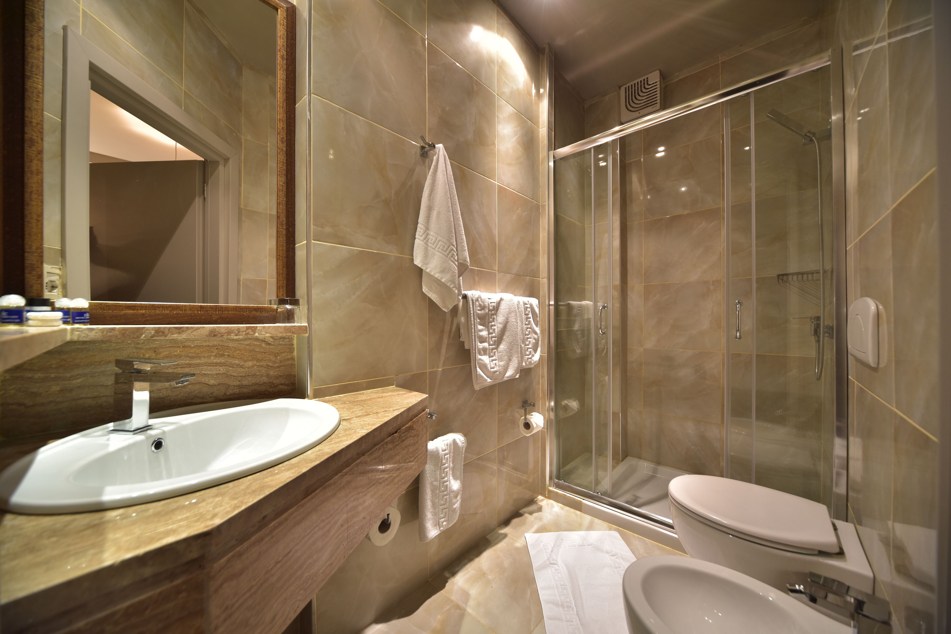 standard double room | bathroom | separate bathtub and shower, deep-soaking bathtub, designer toiletries