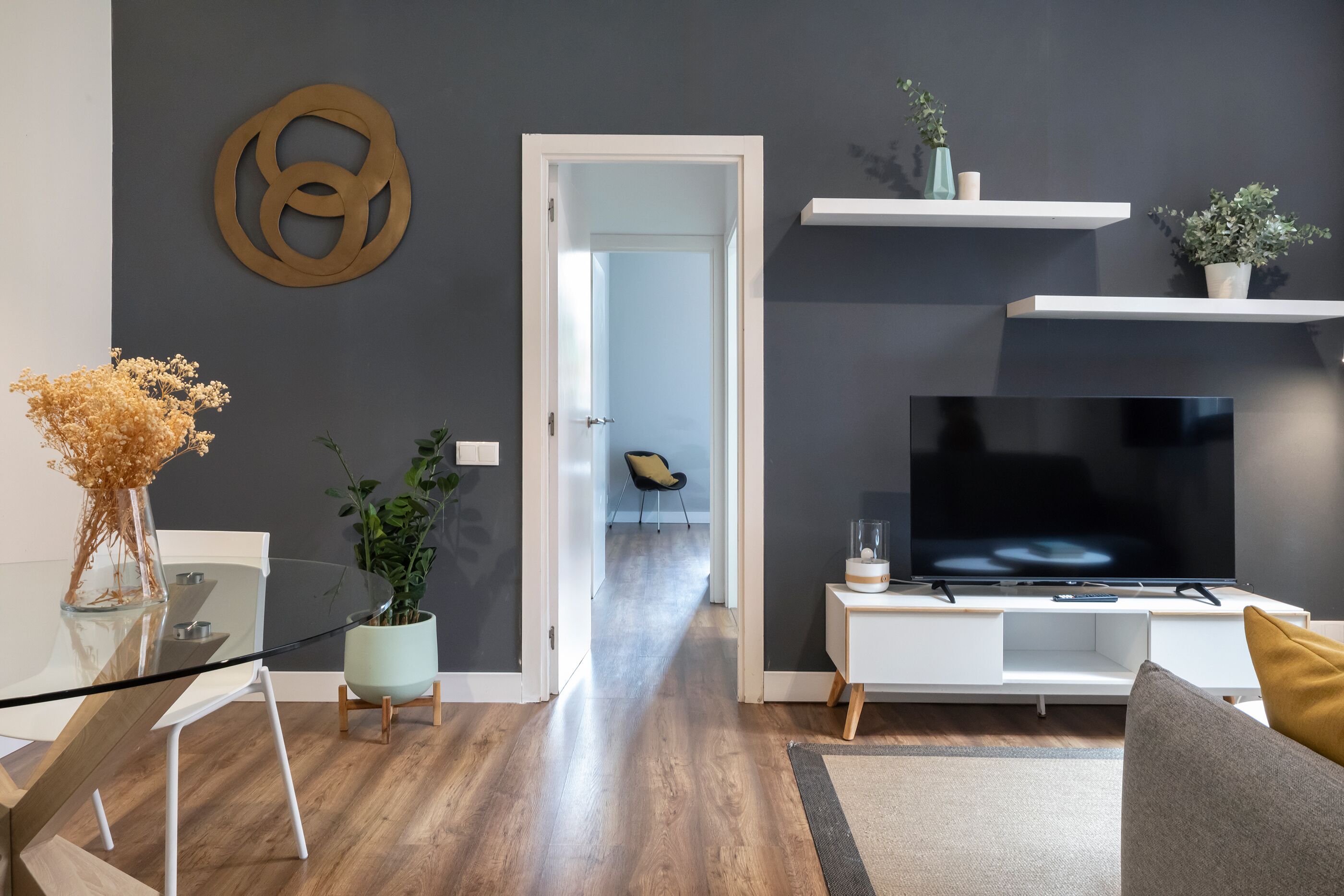 Apartment, 2 Bedrooms, Ground Floor (Carrer de Bilbao 11) | Living area | 32-inch flat-screen TV with satellite channels, TV, DVD player