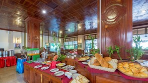A buffet with various food items and a coffee station. - Lin Ratanak Angkor Hotel (Siem Reap)