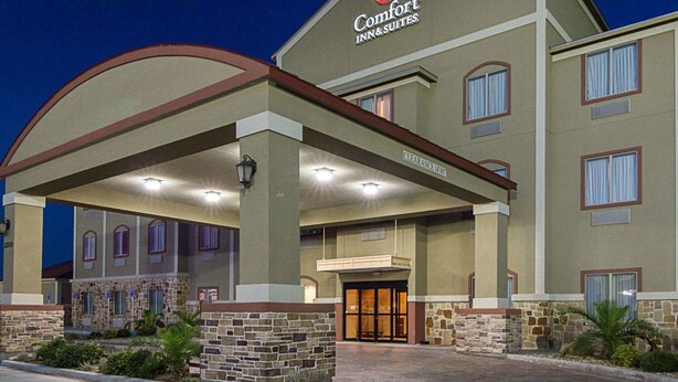 A Comfort Inn & Suites hotel with a covered entrance, stone facade, and multiple windows. - Comfort Inn & Suites Monahans I-20 (Monahans)