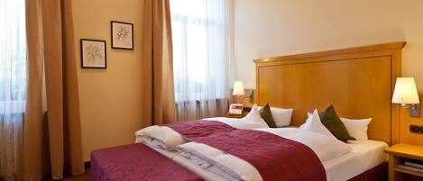 Hypo-allergenic bedding, down duvets, in-room safe