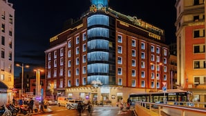 A hotel with a prominent 'Terrazza' sign, a large glass facade, and a rooftop terrace. - Inhala Hotel Garden (Madrid)