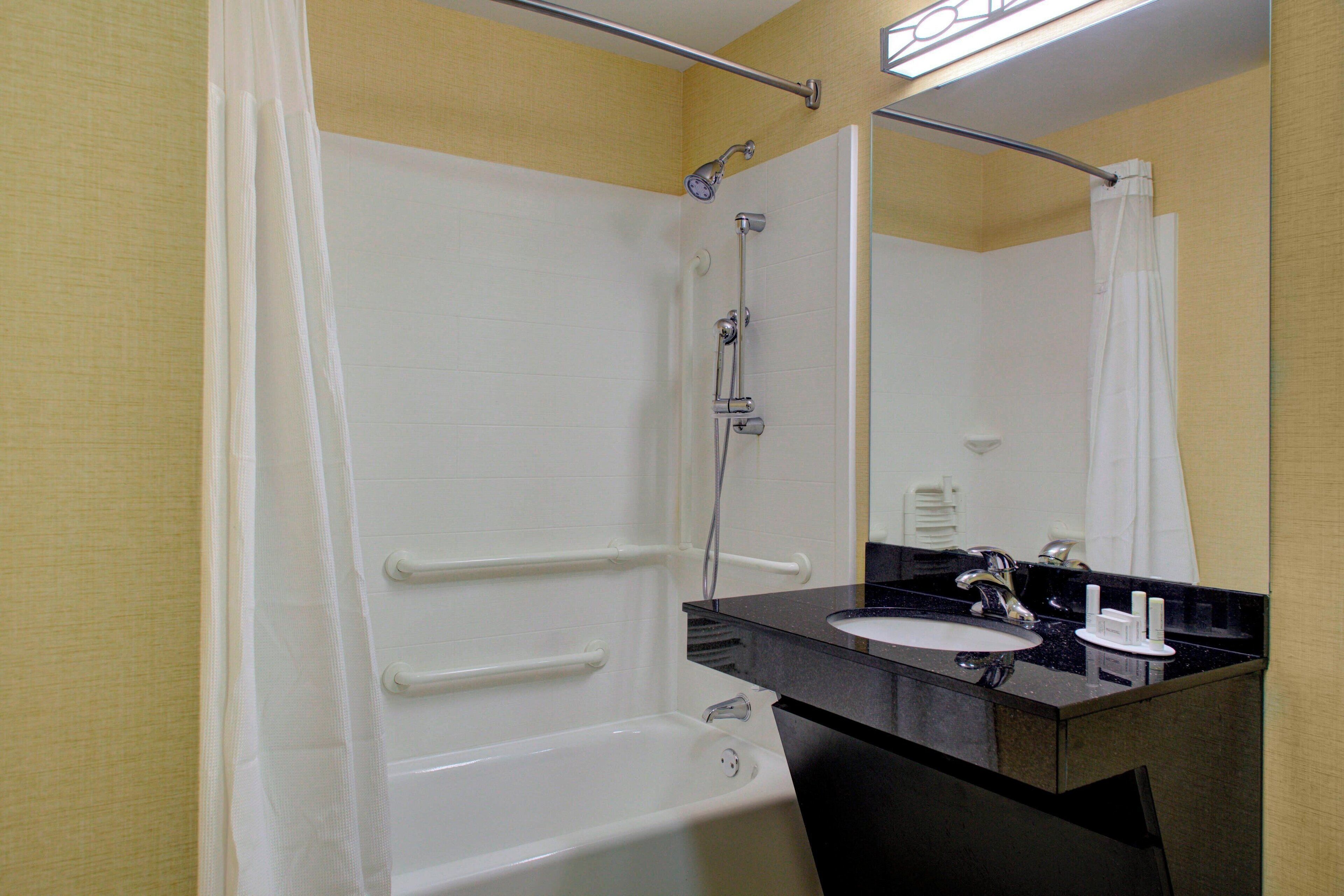 room, 2 queen beds | bathroom | combined shower/bathtub, towels