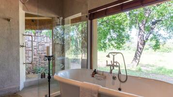Separate bathtub and shower, free toiletries, hair dryer, bathrobes
