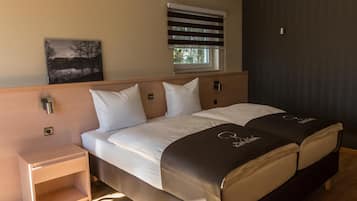 Premium bedding, desk, blackout drapes, soundproofing