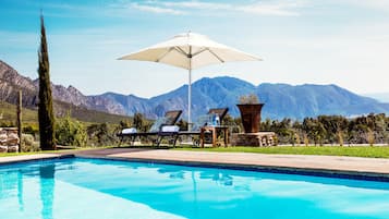 Outdoor pool, pool umbrellas, sun loungers