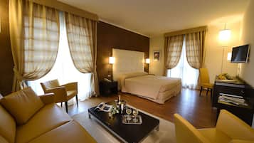 Quadruple Room | Living area | 50-inch TV with digital channels