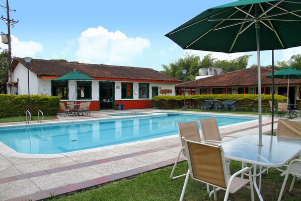 Outdoor pool, pool umbrellas, sun loungers