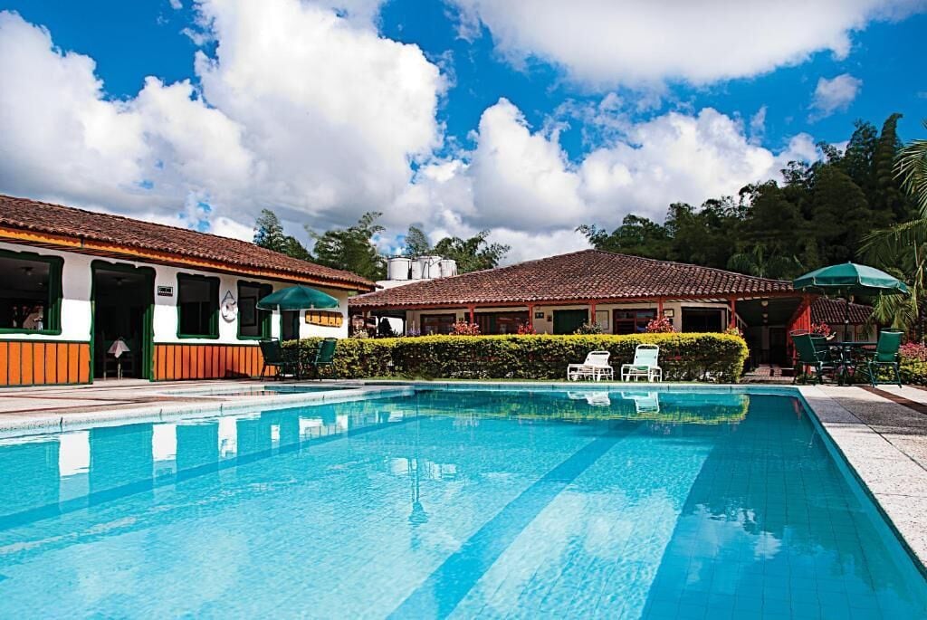 Outdoor pool, pool umbrellas, sun loungers