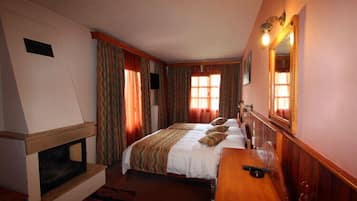 Triple Room (and Fireplace) | In-room safe, rollaway beds, free WiFi