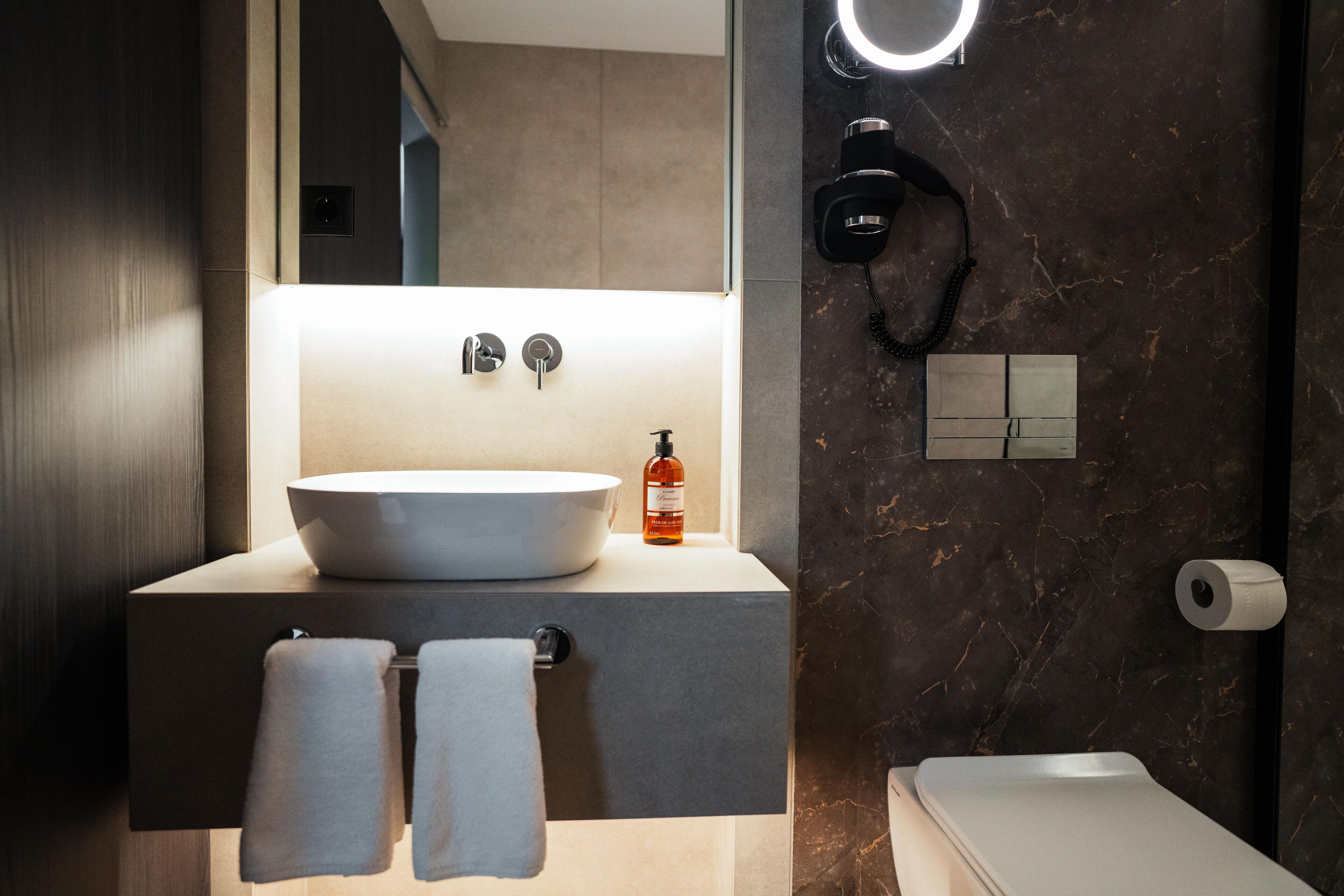 combined shower/bathtub, hair dryer, towels, soap