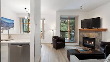 Condo, 2 Bedrooms (Unit 88) | Living area | 50-inch Smart TV with cable channels, fireplace