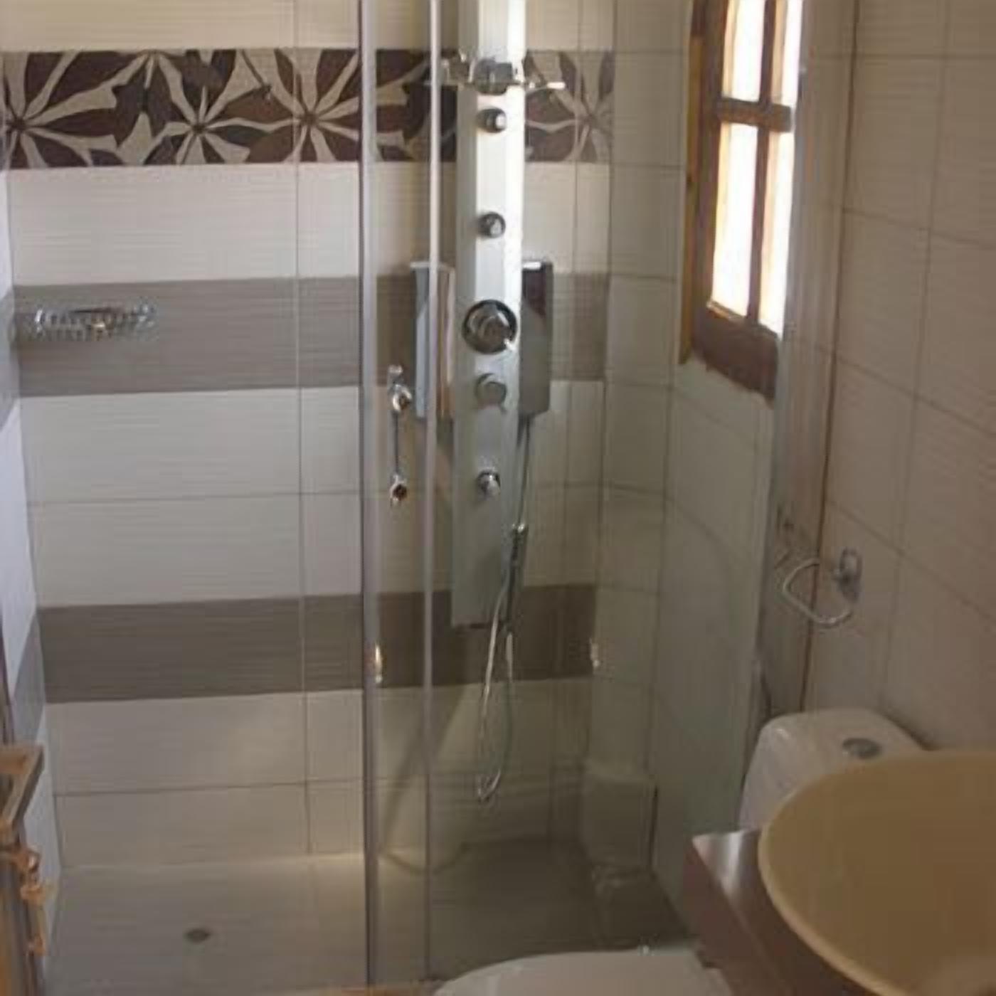 junior suite | bathroom | combined shower/bathtub, hair dryer, slippers, towels