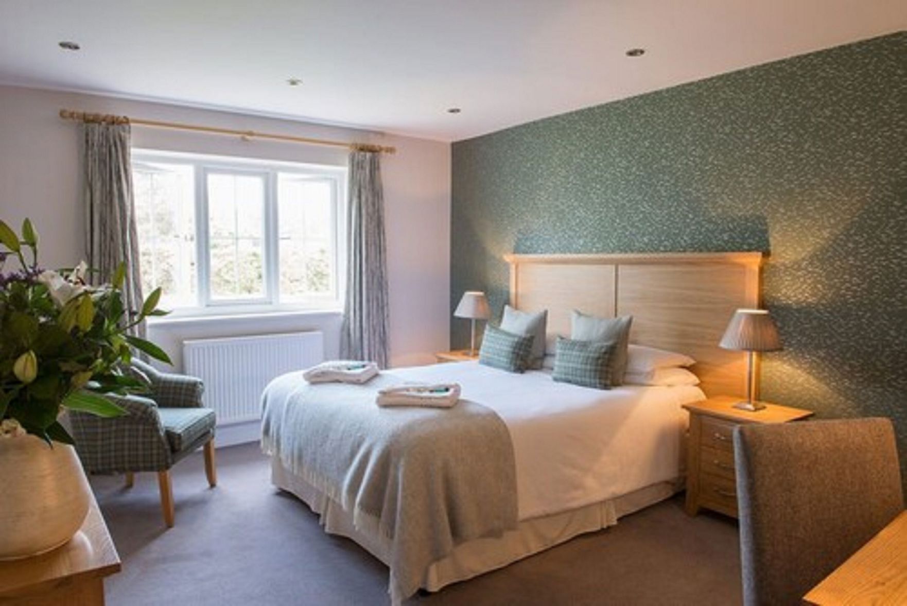 Desk, iron/ironing board, bed sheets