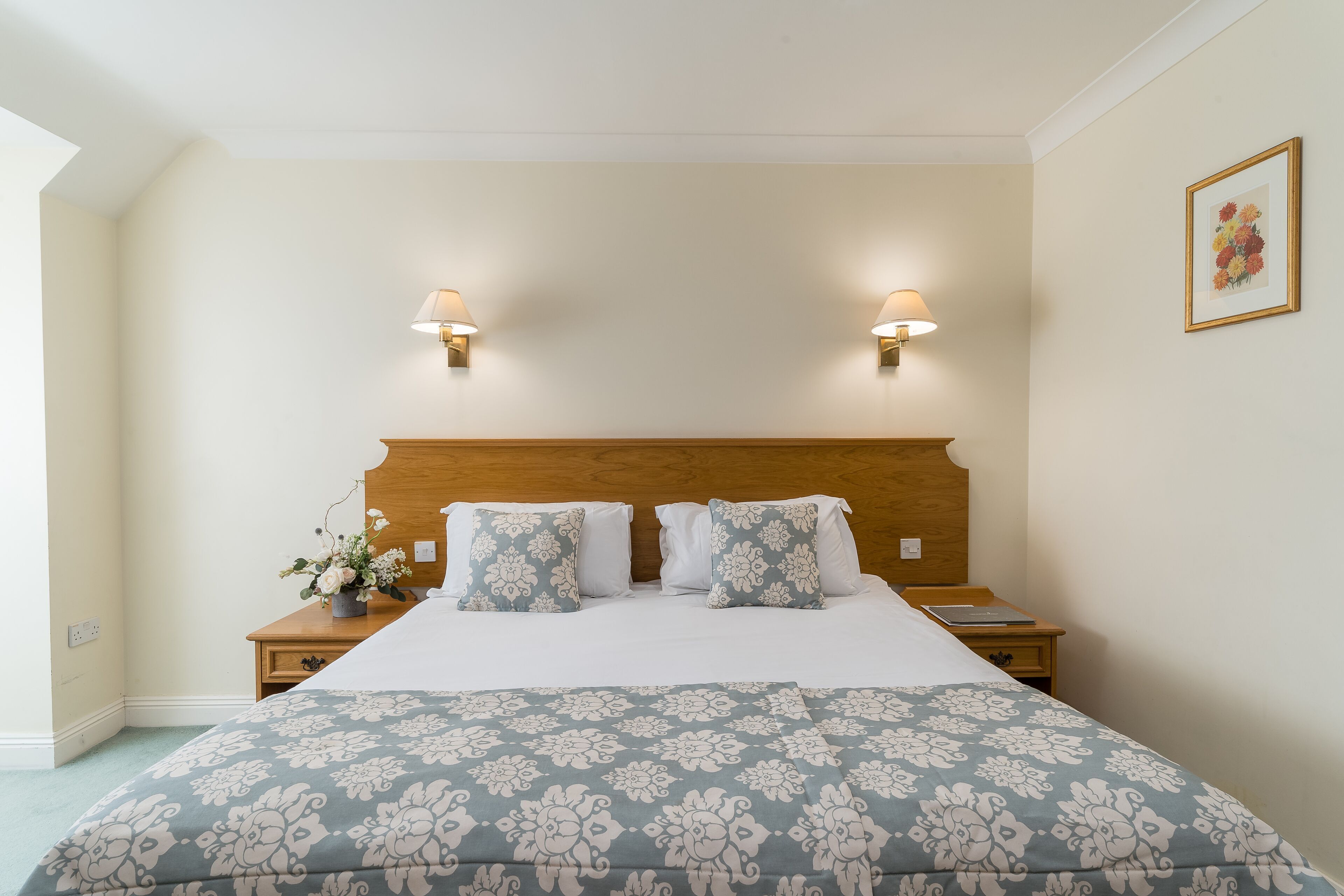 Desk, iron/ironing board, bed sheets