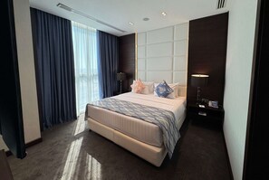 Suite, 1 King Bed, Smoking (Diplomatic) | 1 bedroom, in-room safe, desk, blackout drapes - Ramada Encore by Wyndham Doha (Doha)