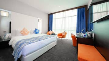 Premium Room | 1 bedroom, in-room safe, desk, blackout drapes