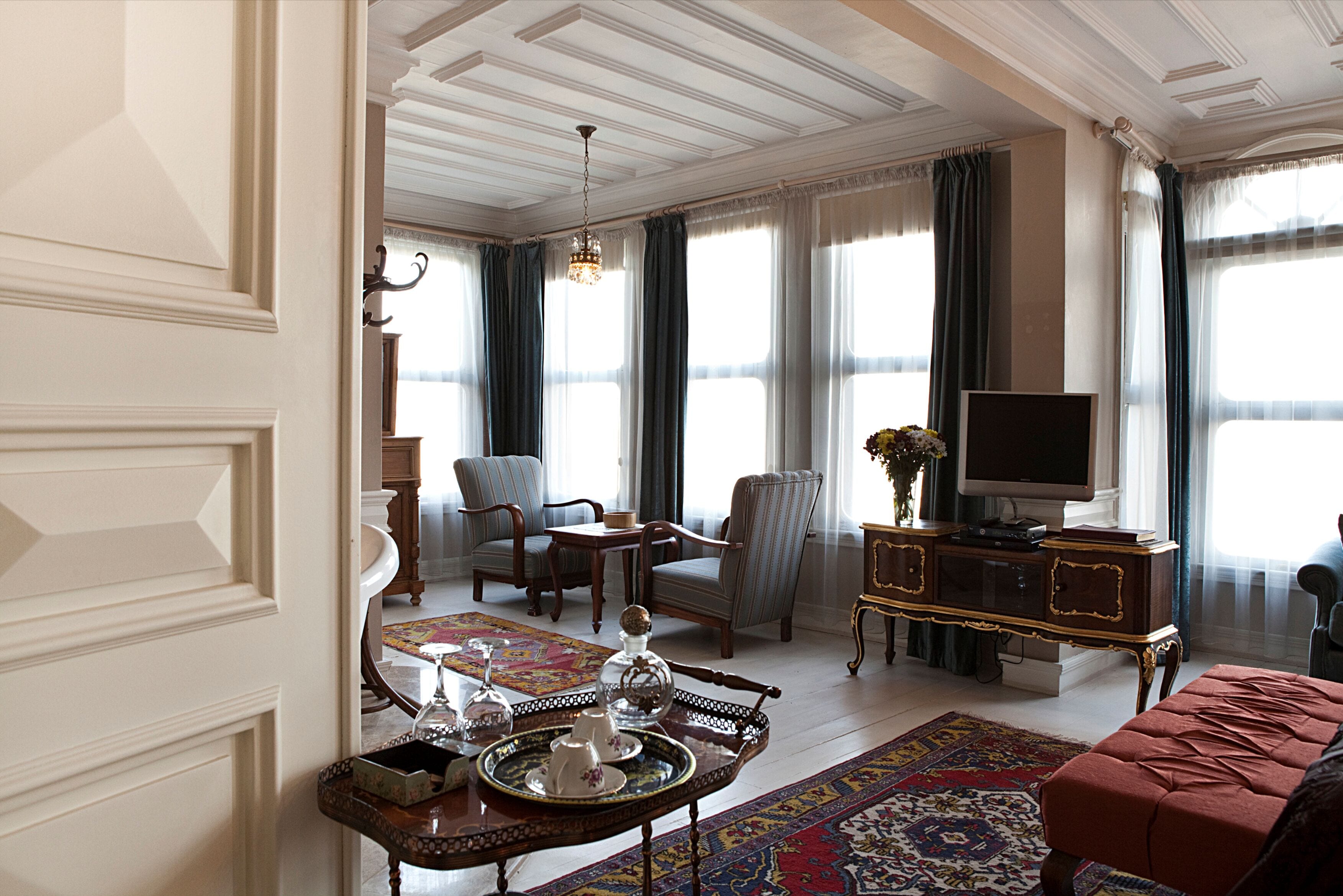 deluxe double room | living area | 55-inch lcd tv with satellite channels, tv