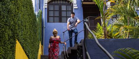 A staircase with a person descending and another ascending.