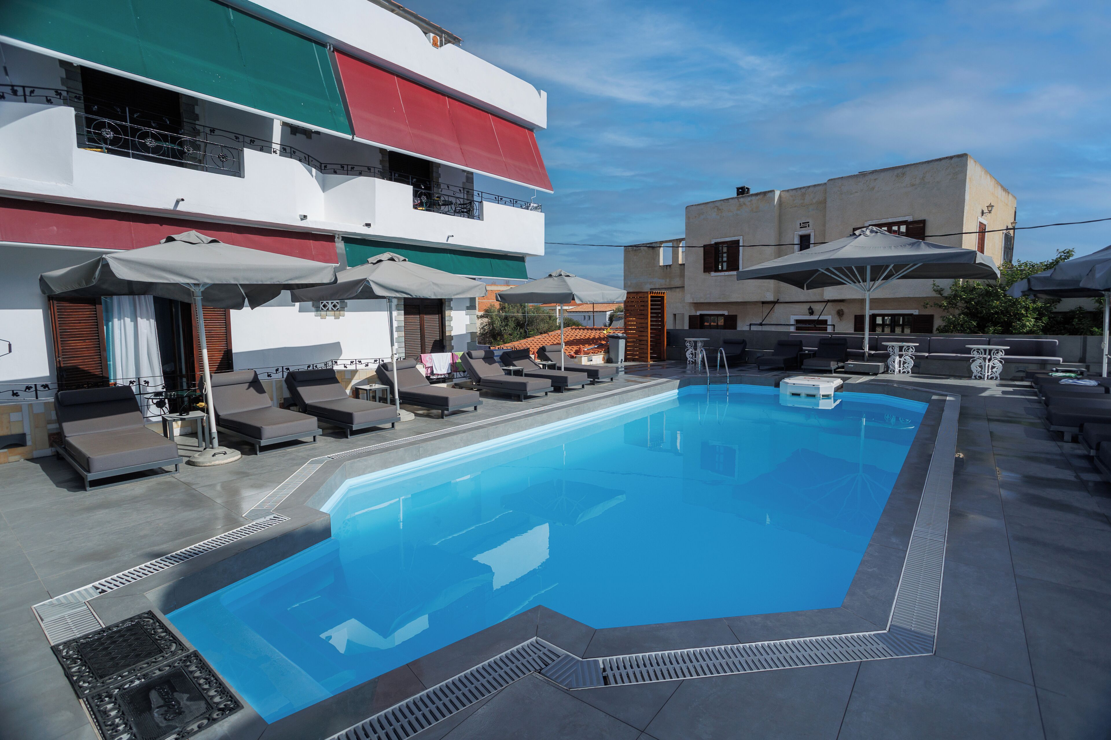 outdoor pool, pool umbrellas, pool loungers