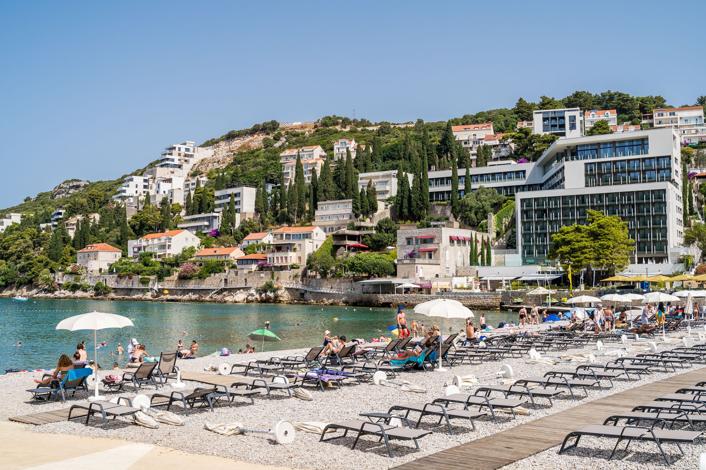 on the beach, beach cabanas, sun-loungers, beach umbrellas