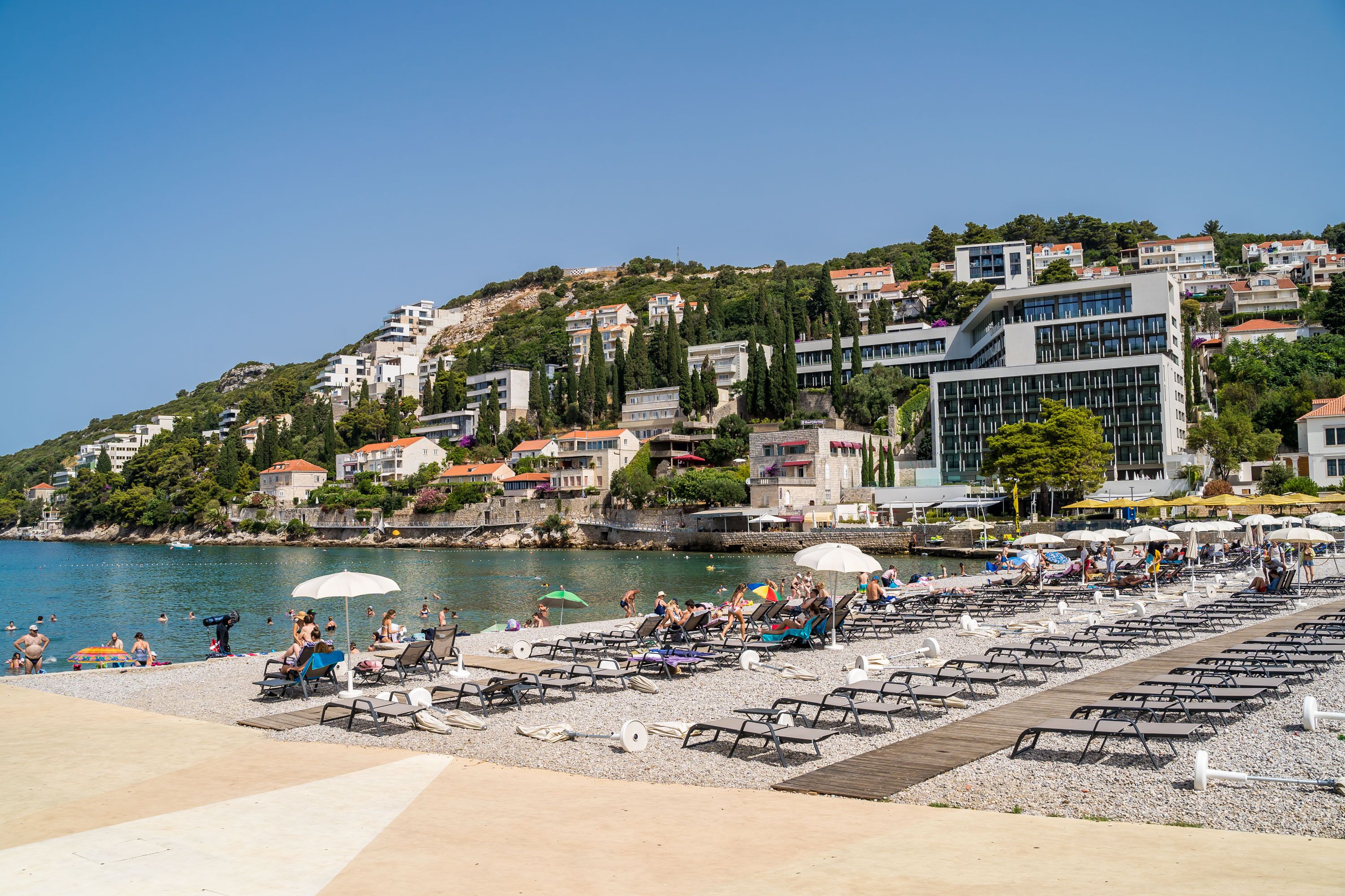 on the beach, beach cabanas, sun-loungers, beach umbrellas