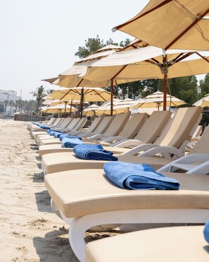 Private beach, beach umbrellas, beach towels, scuba diving
